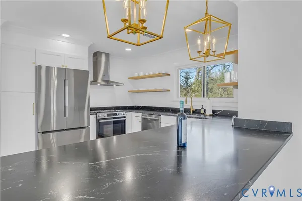 a kitchen with a stove top oven and refrigerator