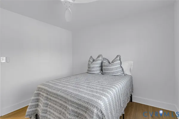 a bedroom with a bed and a table