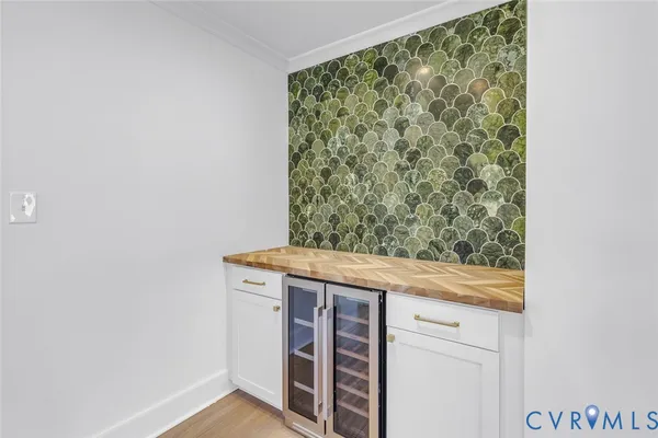 a bathroom with a granite countertop sink a mirror and shower