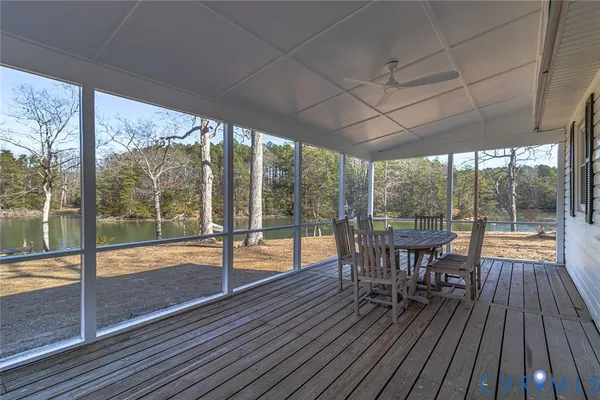 an aerial view of house with yard and lake view