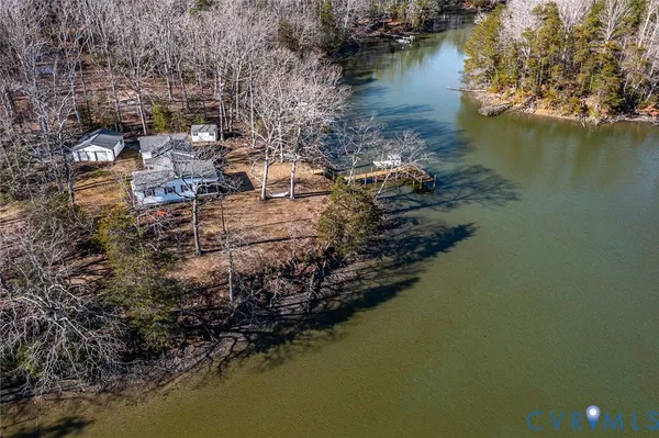 a view of a swimming pool with a patio and a yard