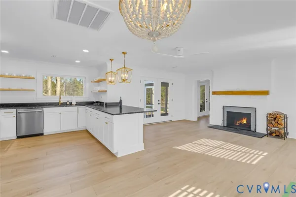 a living room with a fireplace and a fireplace