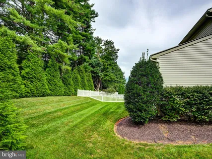 a bathroom with a toilet a sink and a mirror
