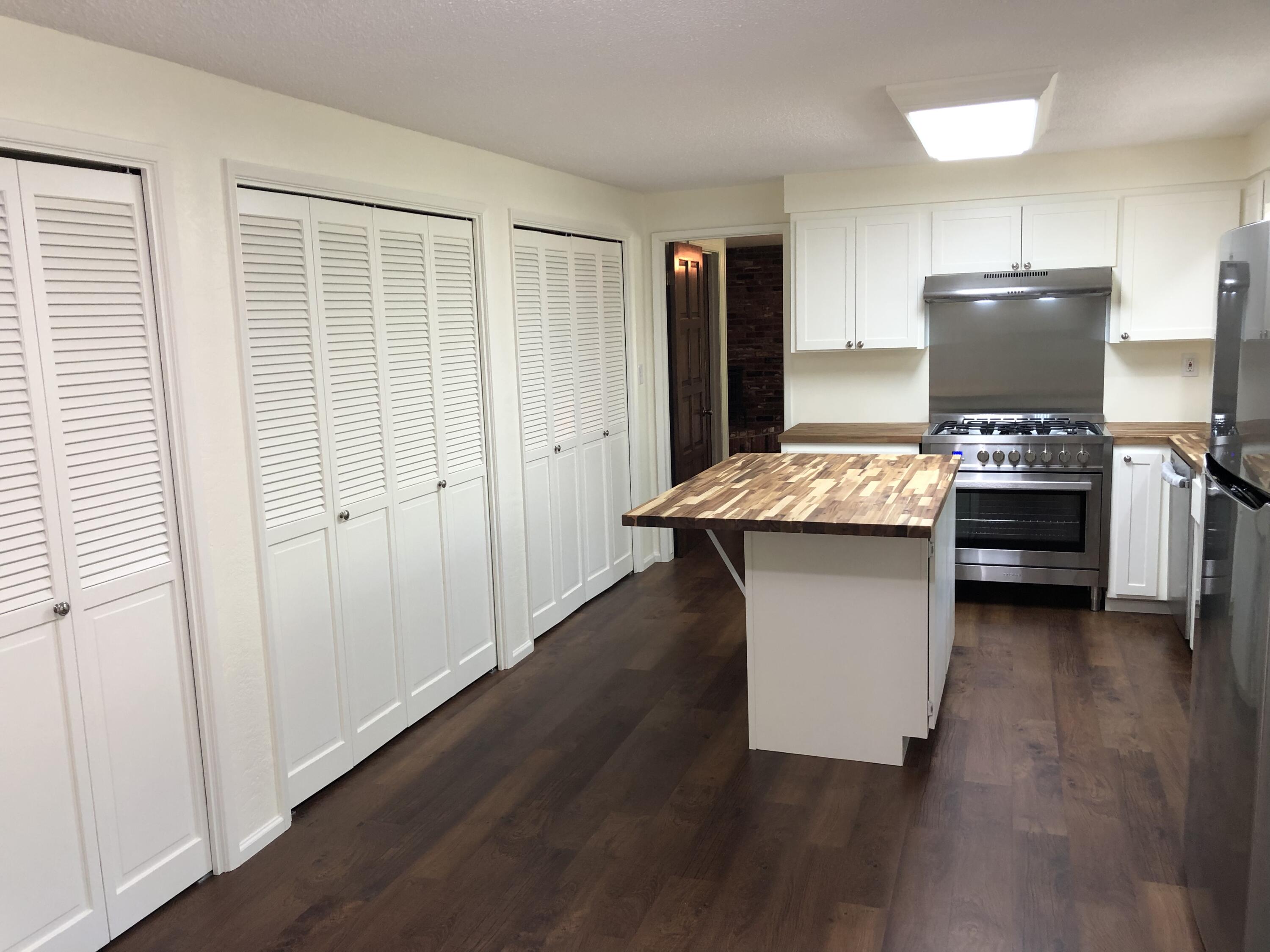 1600 Spring Street Medford, OR 97504 - Photo 9 of 55 kitchen w/ 3 pantry bays