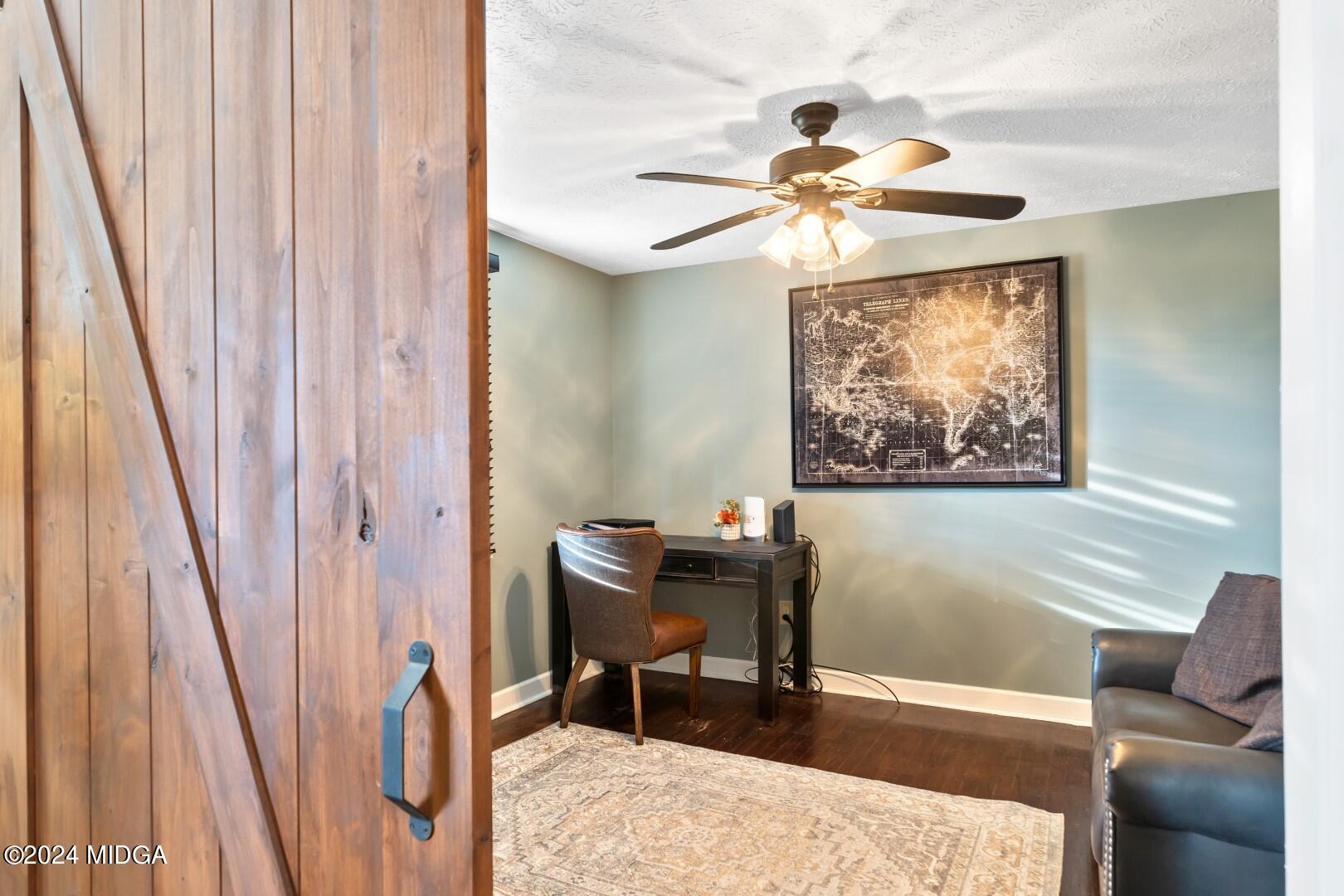 4742 Brookhaven Road Macon, GA 31206 - Photo 15 of 34 a dining room with furniture and a chandelier