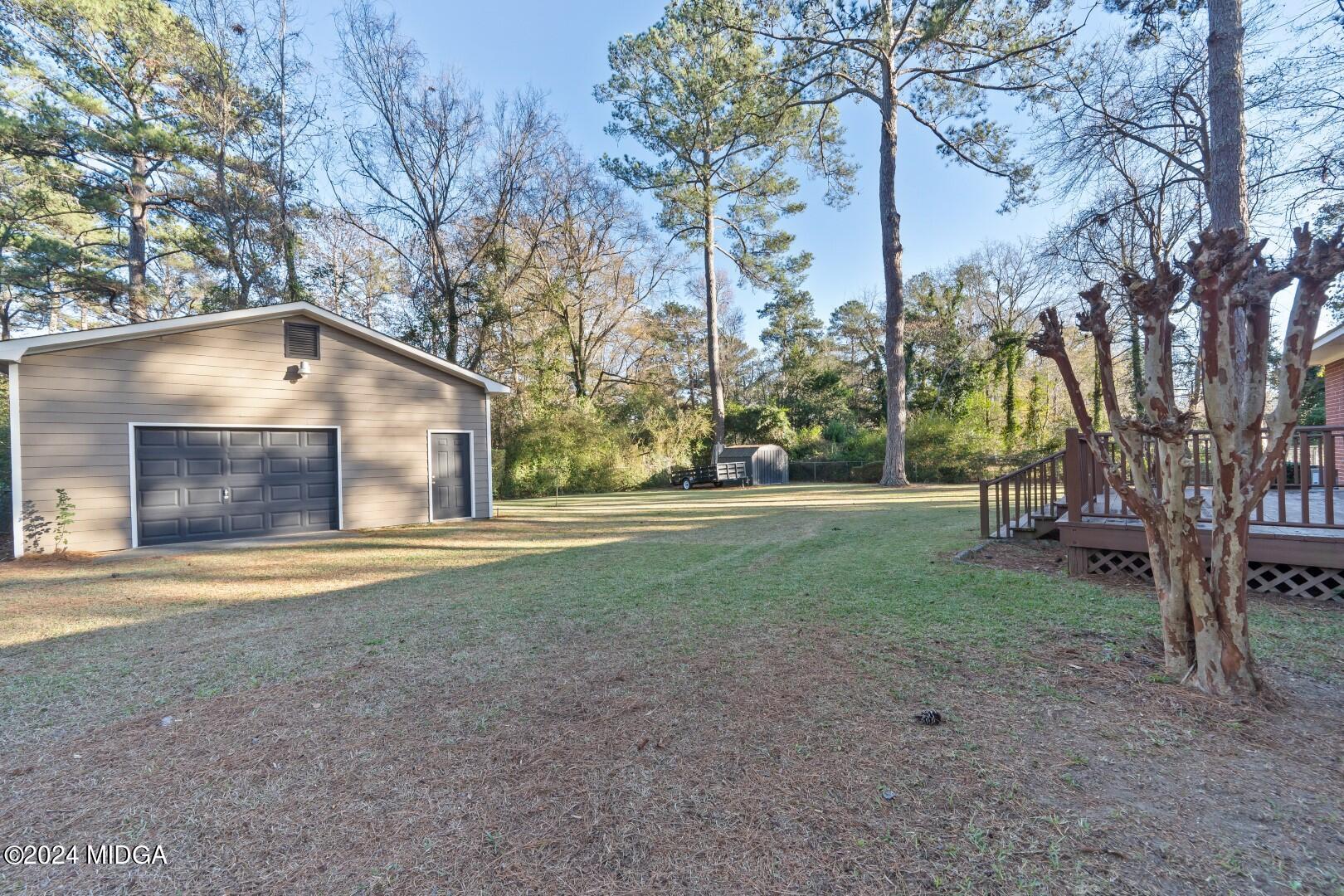 4742 Brookhaven Road Macon, GA 31206 - Photo 3 of 34 a house with trees in front of it