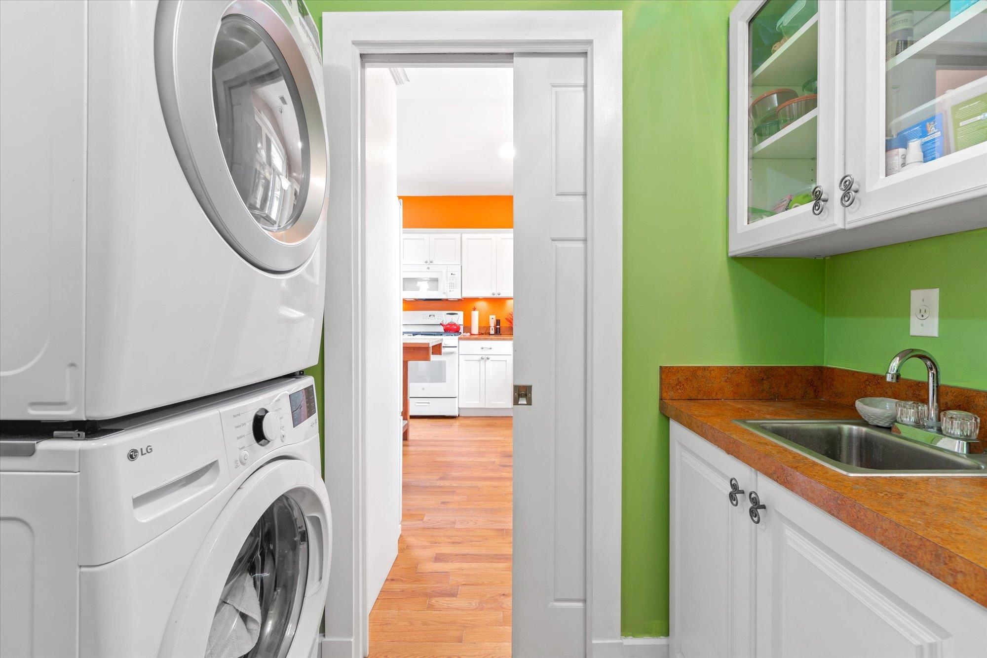 68 Kings Ferry Way St. Augustine, FL 32084 - Photo 16 of 52 Laundry area featuring light wood finished floors and stacked washer / dryer