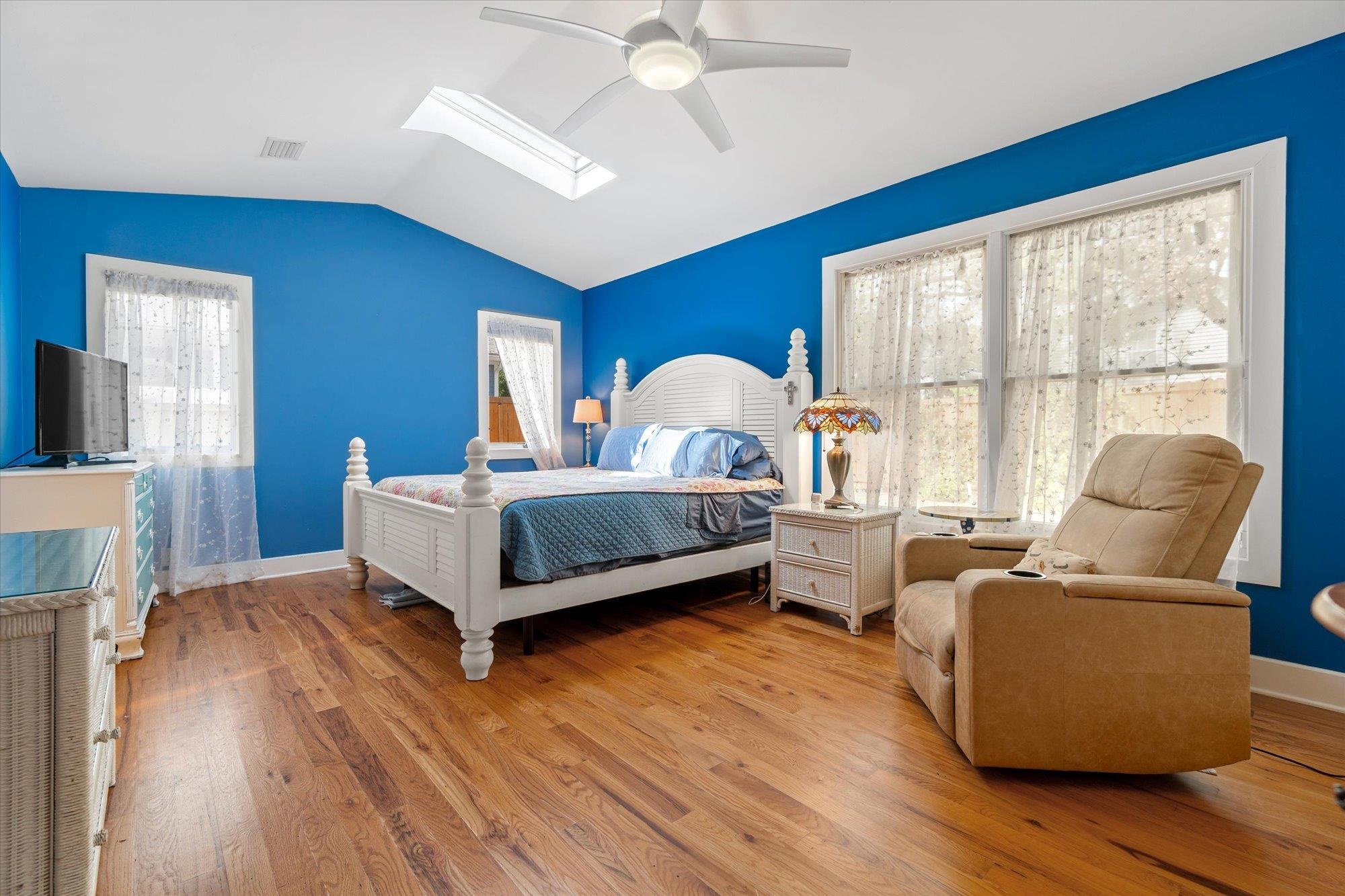 68 Kings Ferry Way St. Augustine, FL 32084 - Photo 20 of 52 Bedroom featuring light wood finished floors, a skylight, a ceiling fan, and lofted ceiling