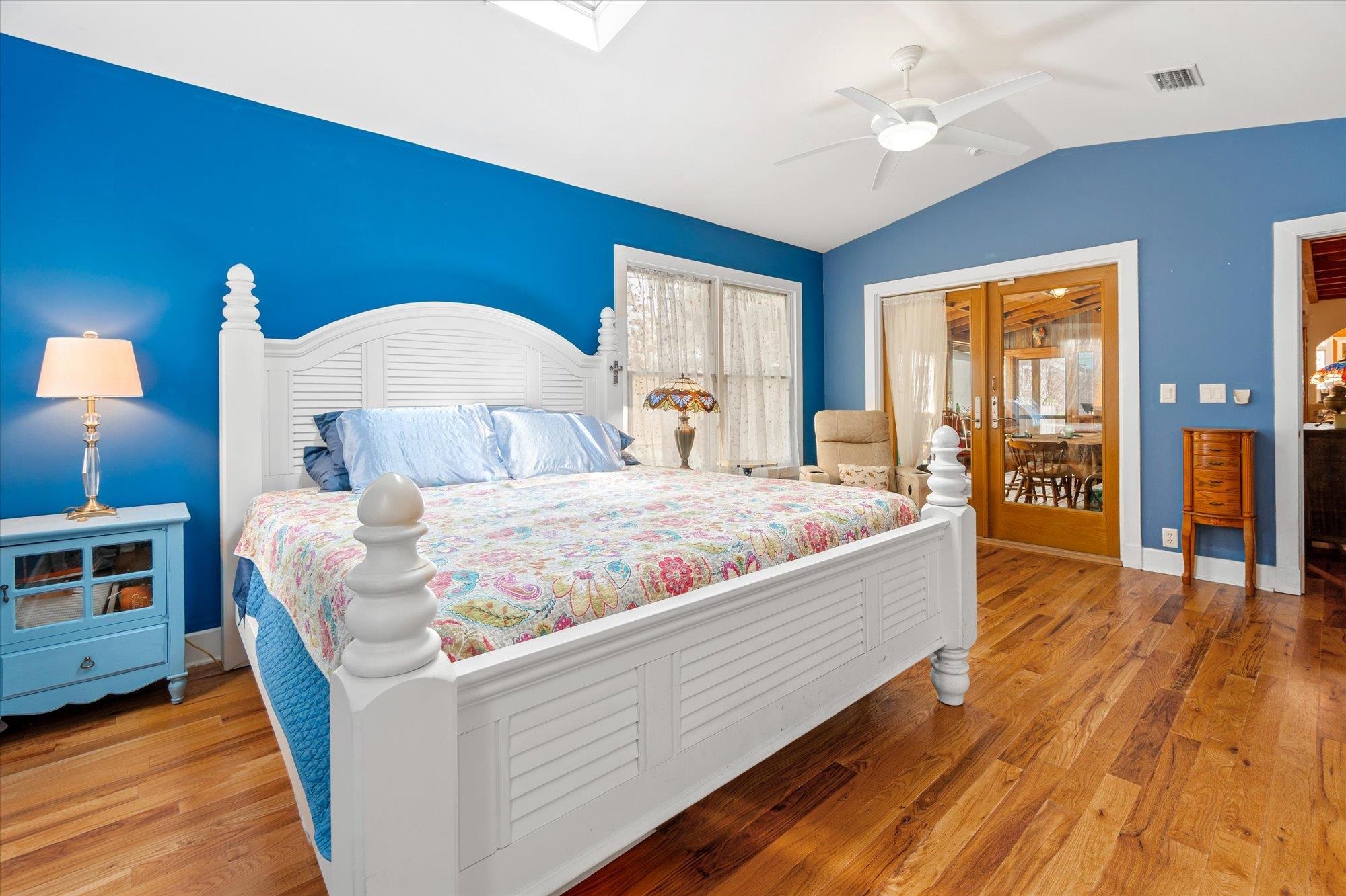 68 Kings Ferry Way St. Augustine, FL 32084 - Photo 21 of 52 Bedroom with light wood finished floors, vaulted ceiling, and ceiling fan