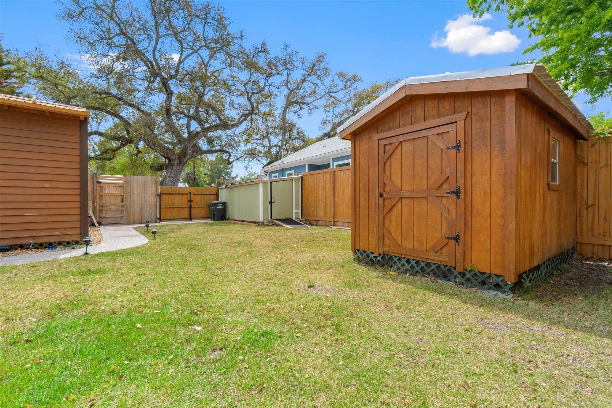 68 Kings Ferry Way St. Augustine, FL 32084 - Photo 33 of 52 Fenced backyard with a shed and a gate