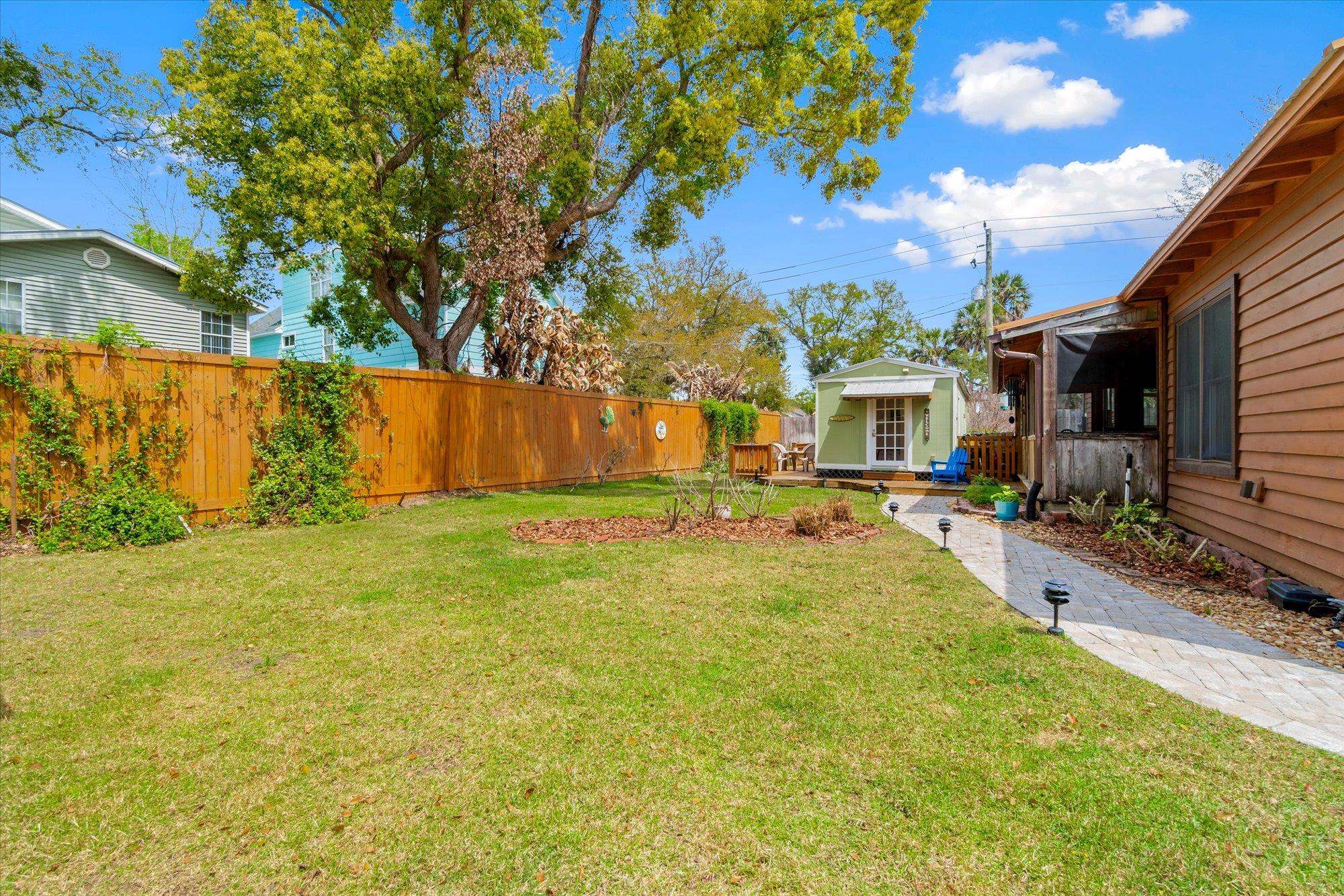 68 Kings Ferry Way St. Augustine, FL 32084 - Photo 35 of 52 Fenced backyard with an outdoor structure and a wooden deck