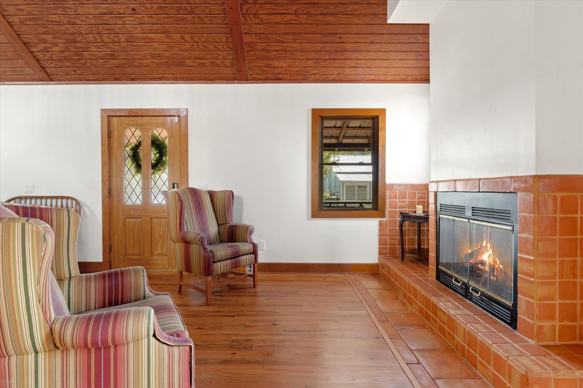 68 Kings Ferry Way St. Augustine, FL 32084 - Photo 4 of 52 Sitting room with fireplace, wood finished floors, and a vaulted wooden ceiling