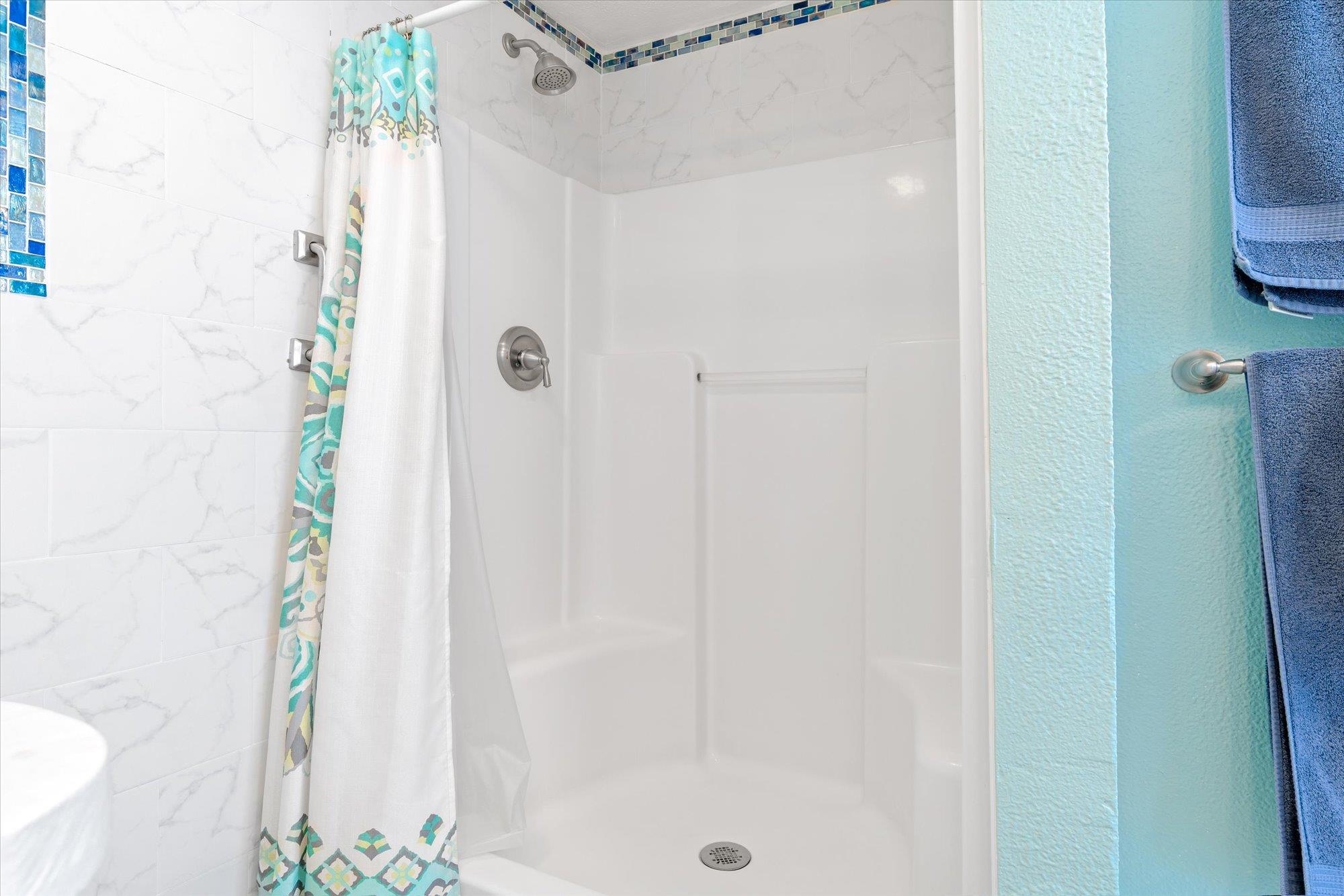 68 Kings Ferry Way St. Augustine, FL 32084 - Photo 43 of 52 Full bathroom featuring a shower stall and a textured wall