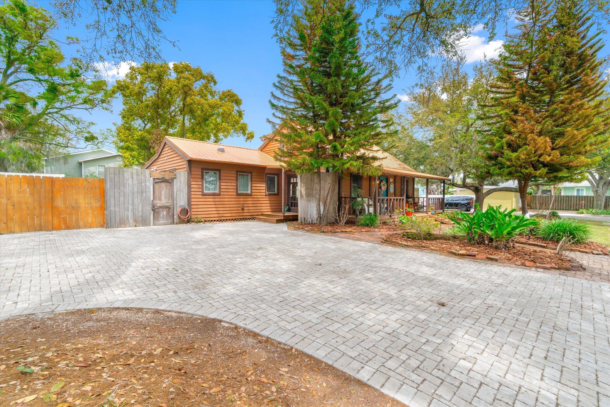 68 Kings Ferry Way St. Augustine, FL 32084 - Photo 46 of 52 View of front facade with a metal roof and a gate