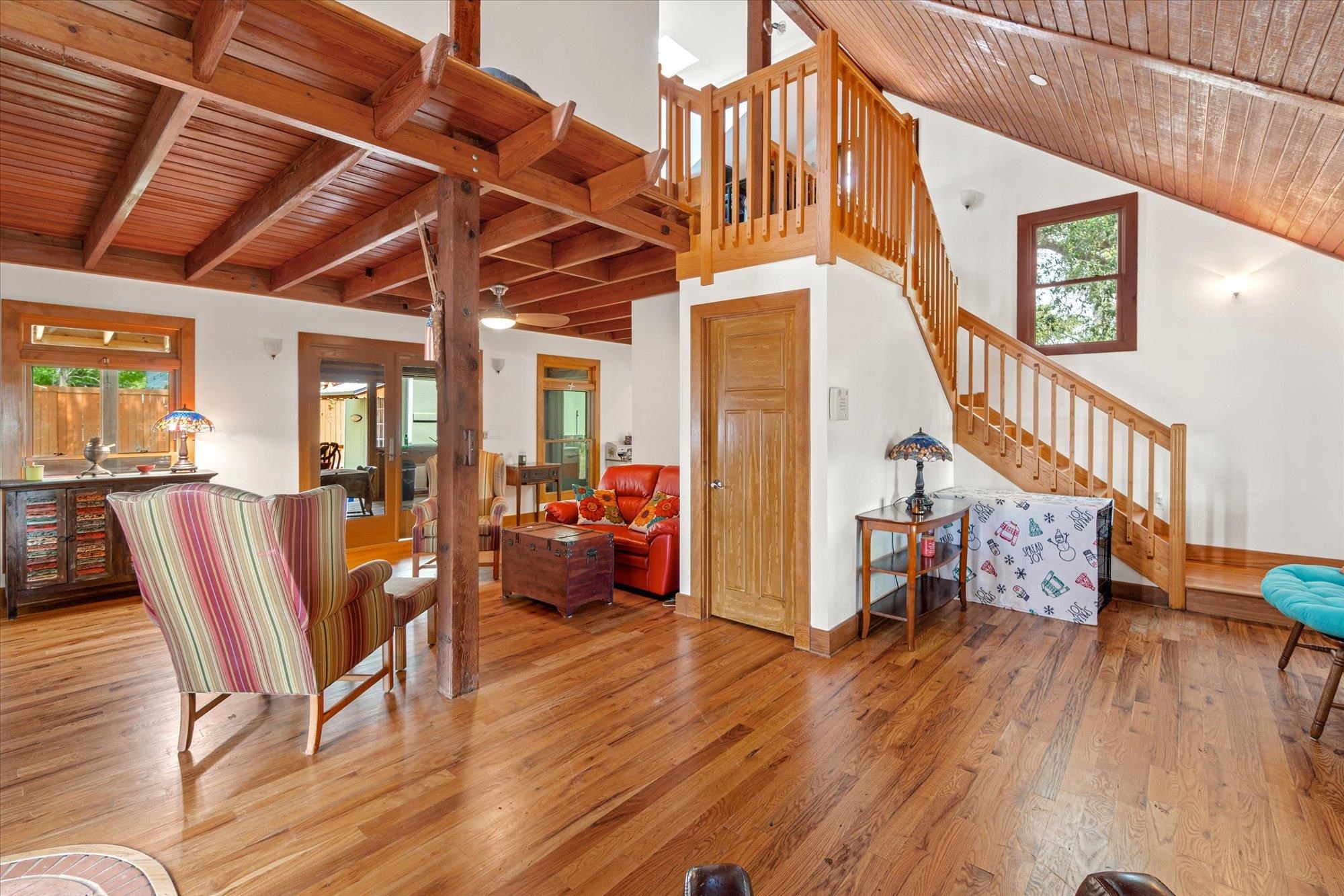 68 Kings Ferry Way St. Augustine, FL 32084 - Photo 5 of 52 Living room featuring a vaulted wood ceiling and wood flooring
