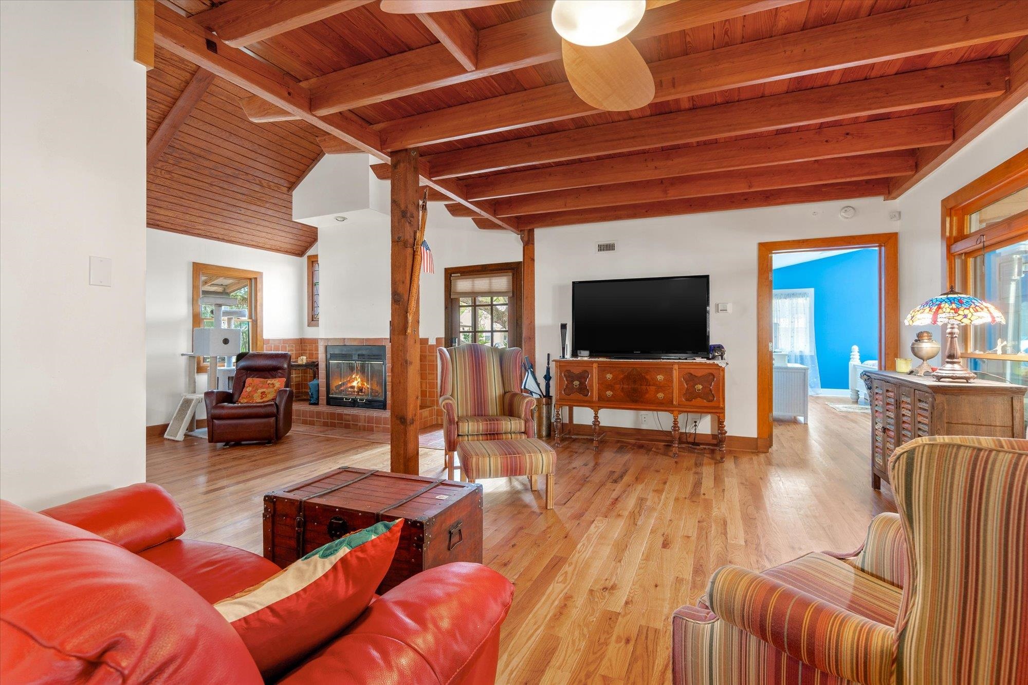 68 Kings Ferry Way St. Augustine, FL 32084 - Photo 6 of 52 Living room with wood ceiling, light wood flooring, vaulted ceiling with beams and fireplace