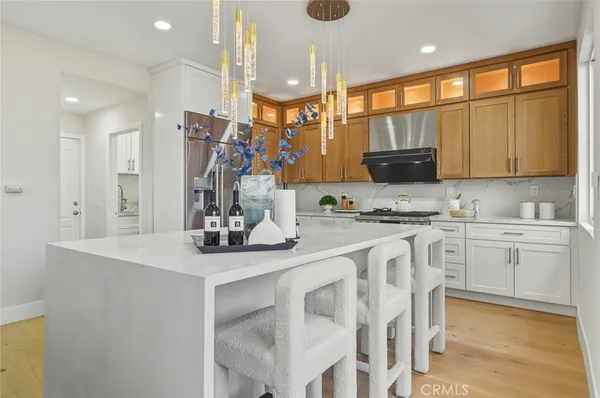 a kitchen with a sink cabinets and window