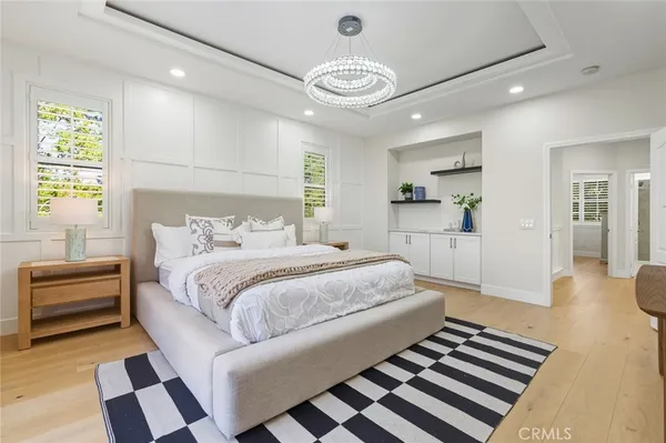 a spacious bedroom with a bed and a couch