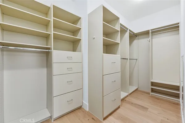 a view of an empty walk in closet