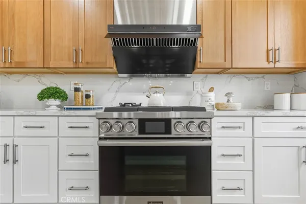 a kitchen with appliances cabinets and a counter top space