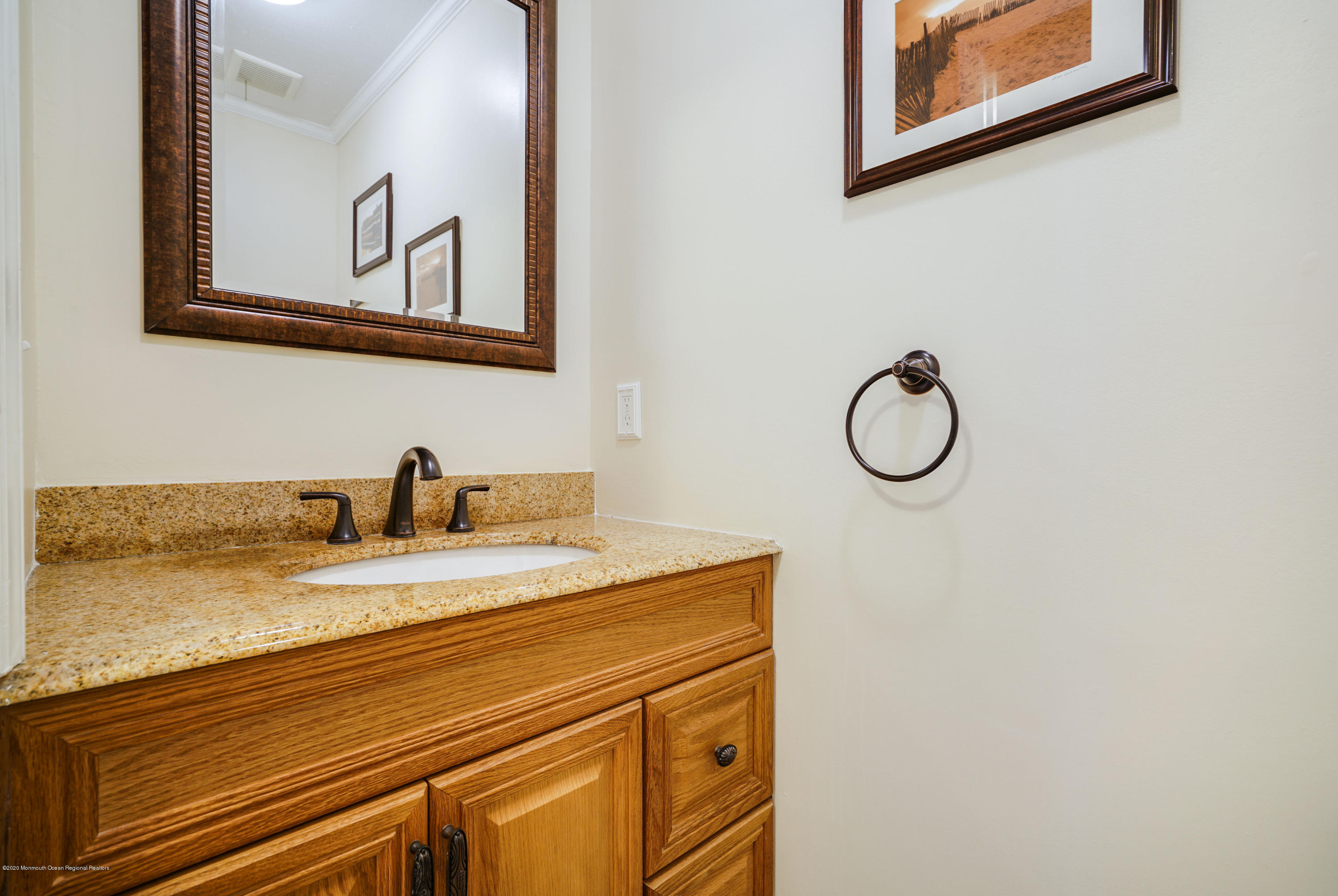 689 Line Road Matawan, NJ 07747 - Photo 11 of 25 a bathroom with a sink and a mirror