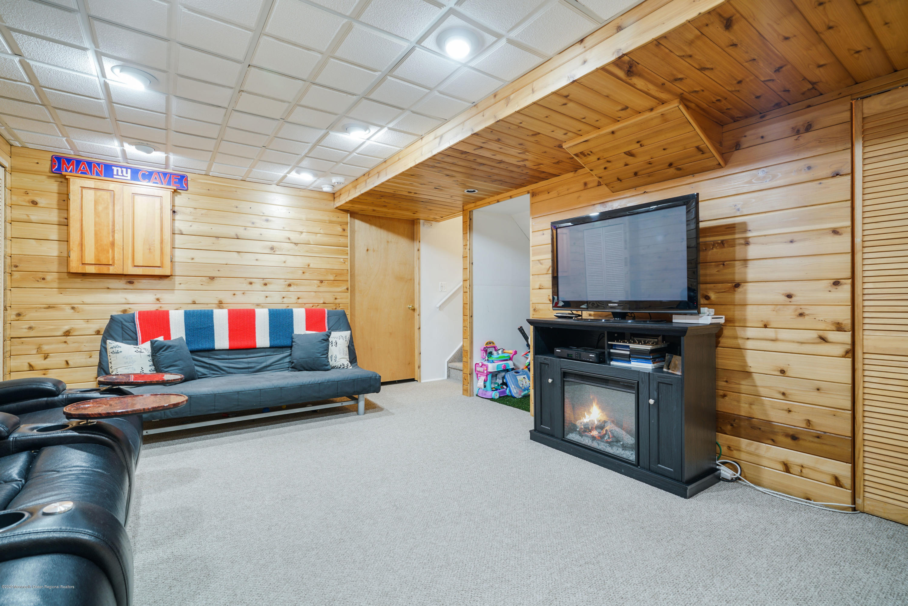 689 Line Road Matawan, NJ 07747 - Photo 19 of 25 a living room with furniture and a flat screen tv