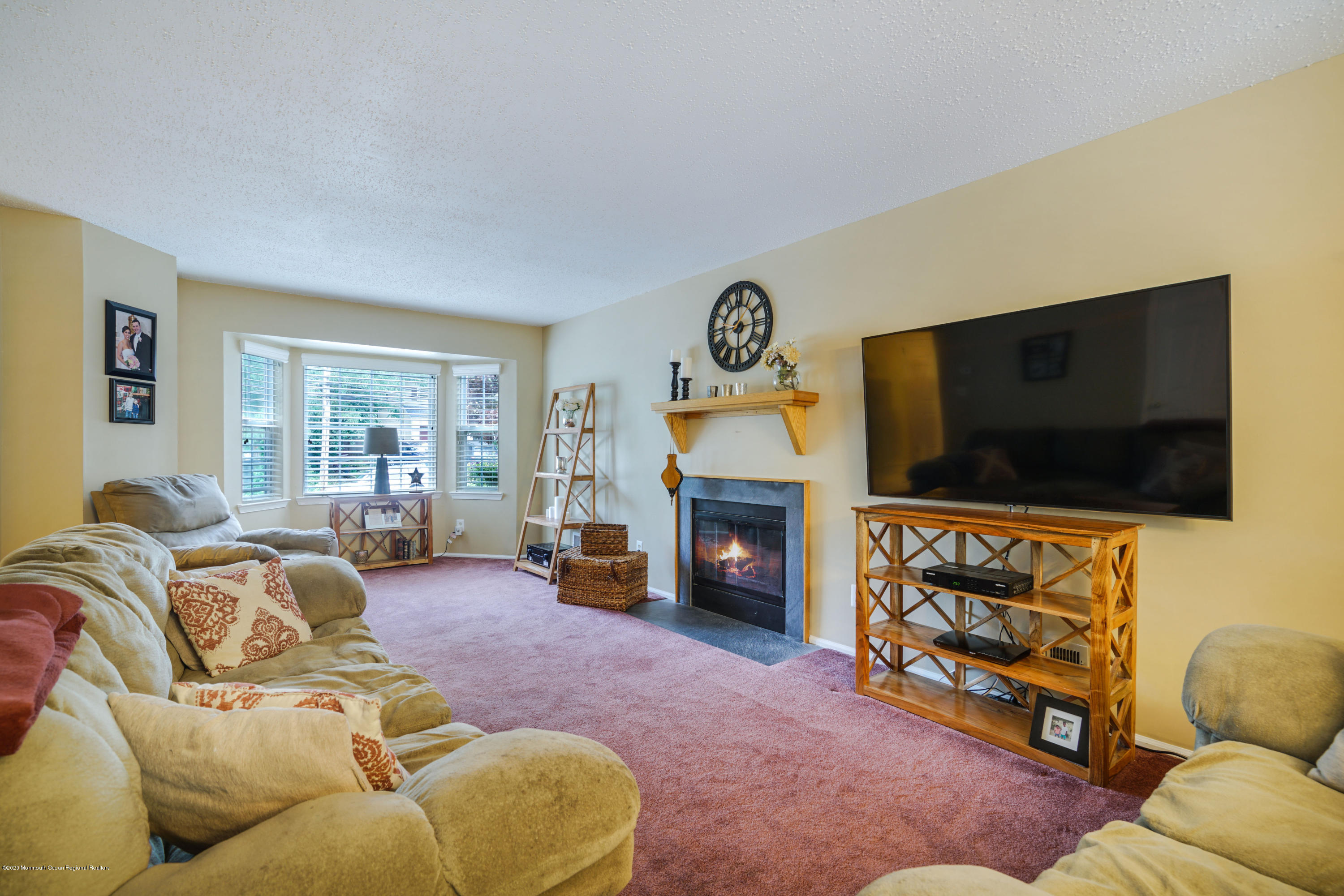 689 Line Road Matawan, NJ 07747 - Photo 4 of 25 a living room with furniture and a flat screen tv