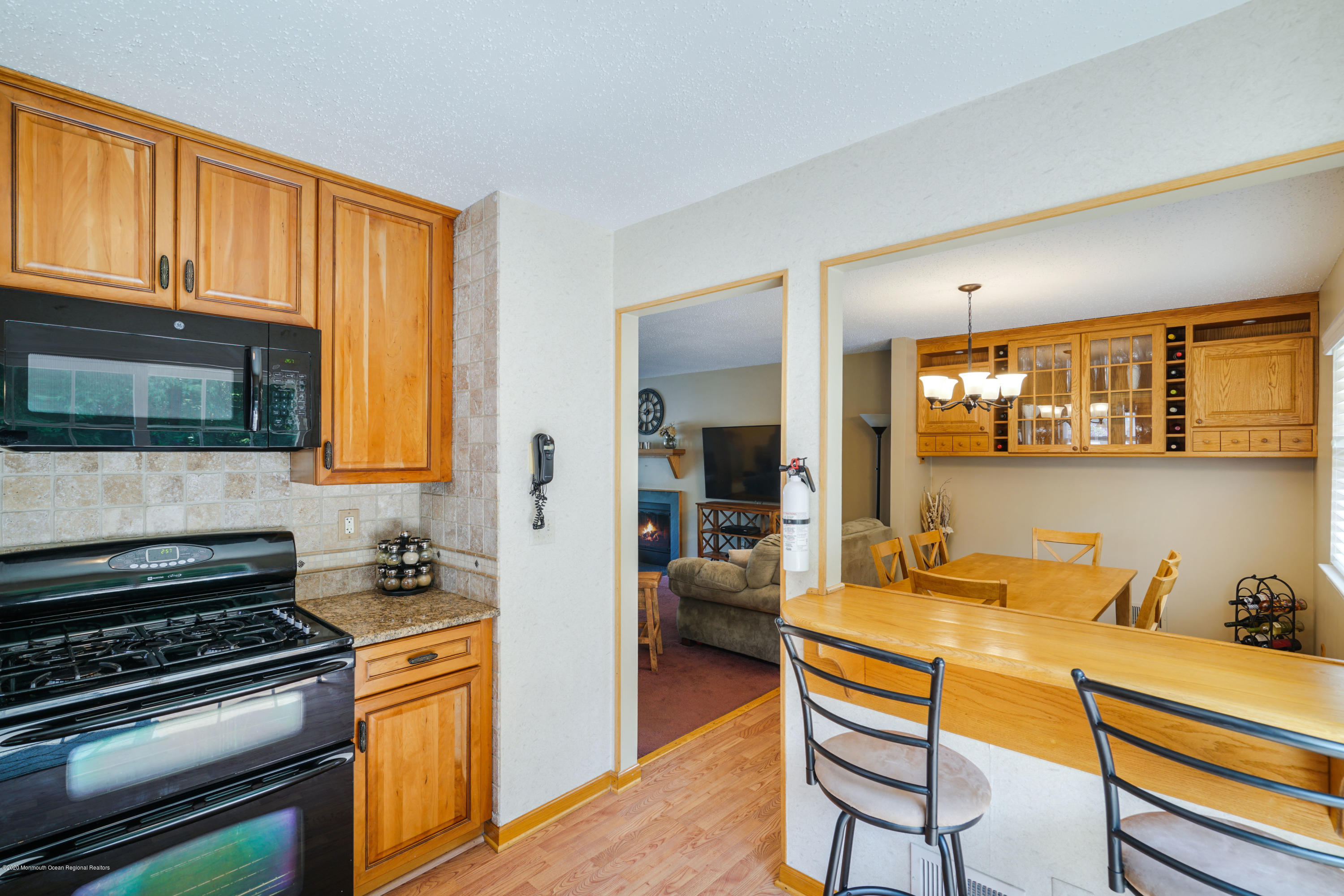 689 Line Road Matawan, NJ 07747 - Photo 9 of 25 a kitchen with stainless steel appliances granite countertop a stove and cabinets
