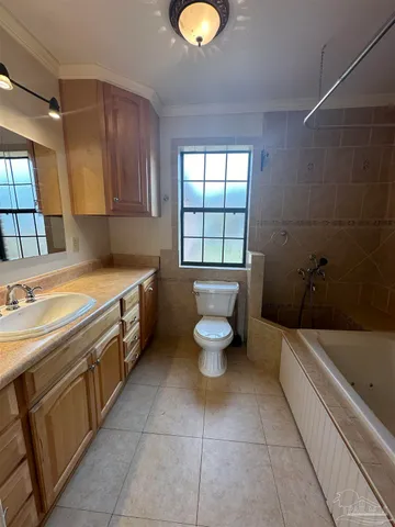 a bathroom with a sink a toilet and bathtub