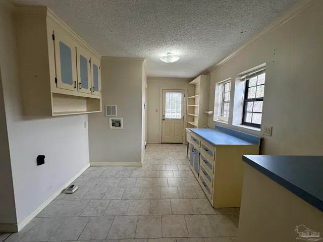 a kitchen with stainless steel appliances granite countertop a sink and cabinets