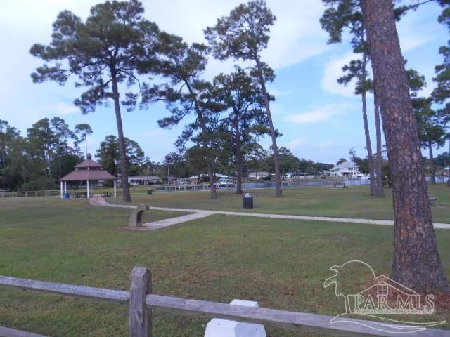 a view of a golf course with a lake