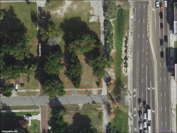 an aerial view of residential house with outdoor space