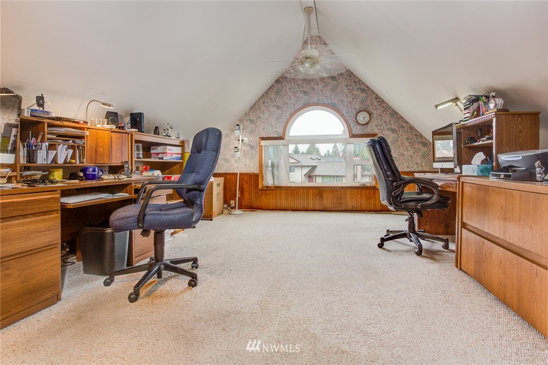 2525 166th Place Southeast Bothell, WA 98012 - Photo 4 of 25 a view of a workspace with furniture and a window