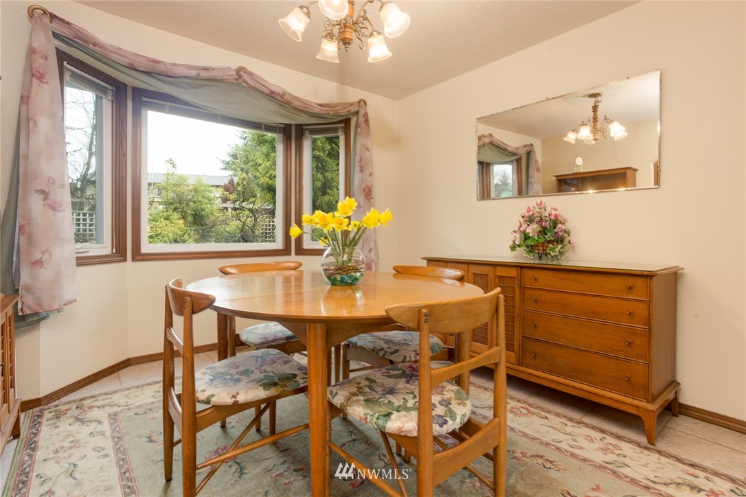 2525 166th Place Southeast Bothell, WA 98012 - Photo 5 of 25 a view of a dining room with furniture and window