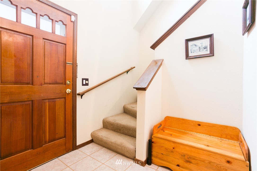 2525 166th Place Southeast Bothell, WA 98012 - Photo 8 of 25 a view of staircase with white walls and a painting on the wall