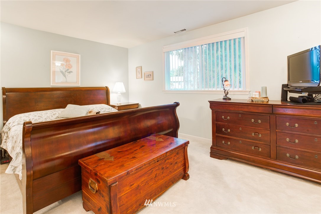 2525 166th Place Southeast Bothell, WA 98012 - Photo 9 of 25 a bedroom with a bed and a television