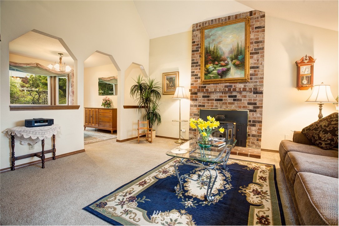 2525 166th Place Southeast Bothell, WA 98012 - Photo 10 of 25 a living room with furniture and a fireplace