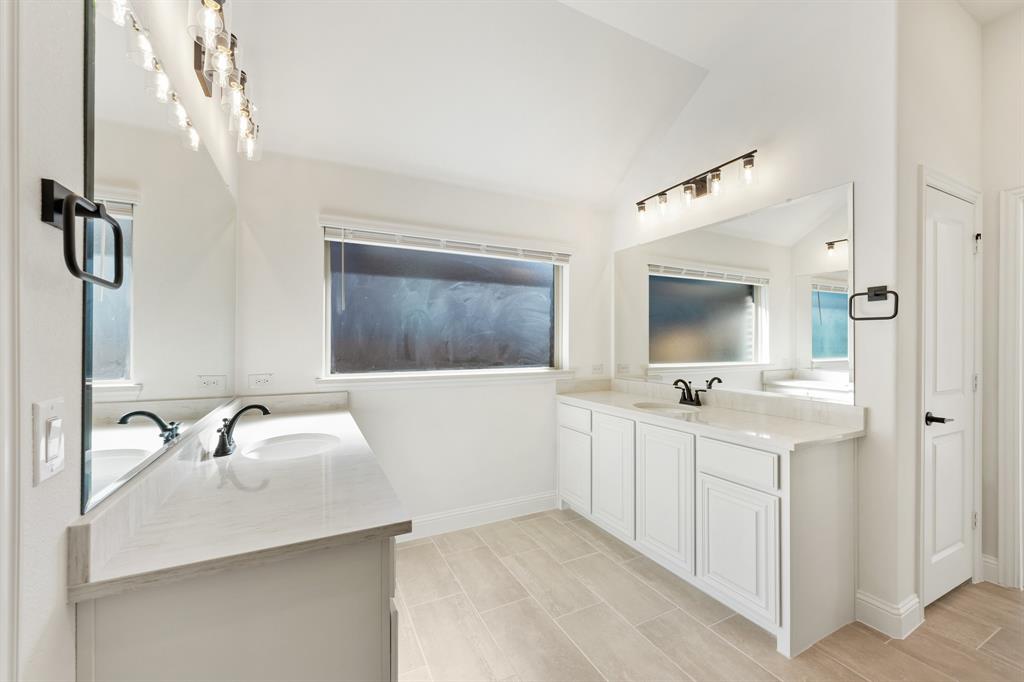2005 Ambergate Drive Anna, TX 75409 - Photo 28 of 35 a en suite bathroom with a double vanity sink and mirror