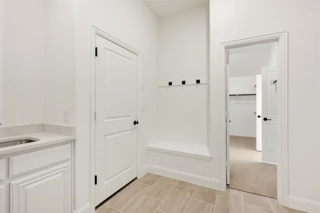 a view of a door with a door and wooden floor