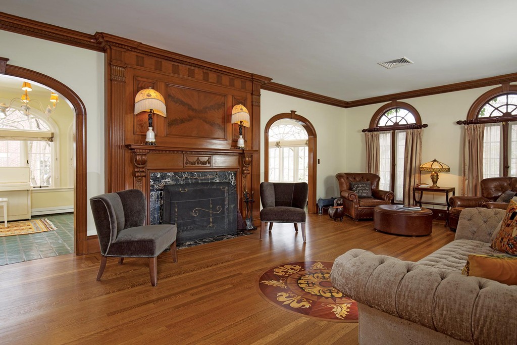 95 Clinton Road Brookline, MA 02445 - Photo 4 of 19 a living room with furniture and a fireplace