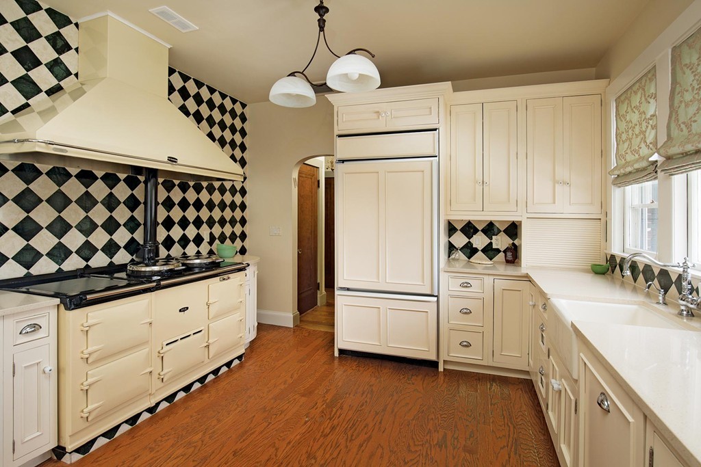 95 Clinton Road Brookline, MA 02445 - Photo 6 of 19 a kitchen with granite countertop white cabinets and white appliances
