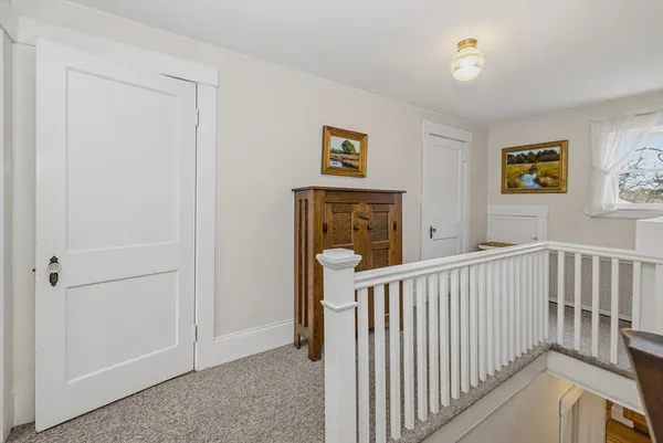 a view of hallway with furniture