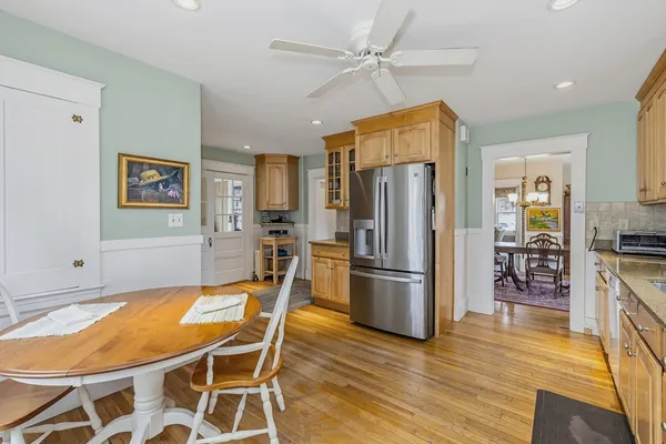 a kitchen with stainless steel appliances granite countertop a refrigerator stove microwave and cabinets
