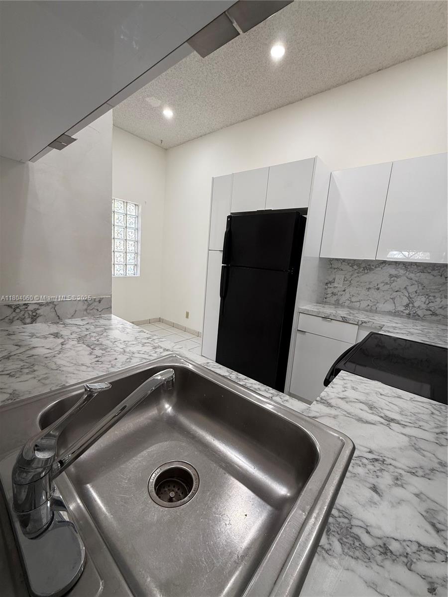10631 Northwest 14th Street, Unit 229 Plantation, FL 33322 - Photo 4 of 12 a view of a kitchen island