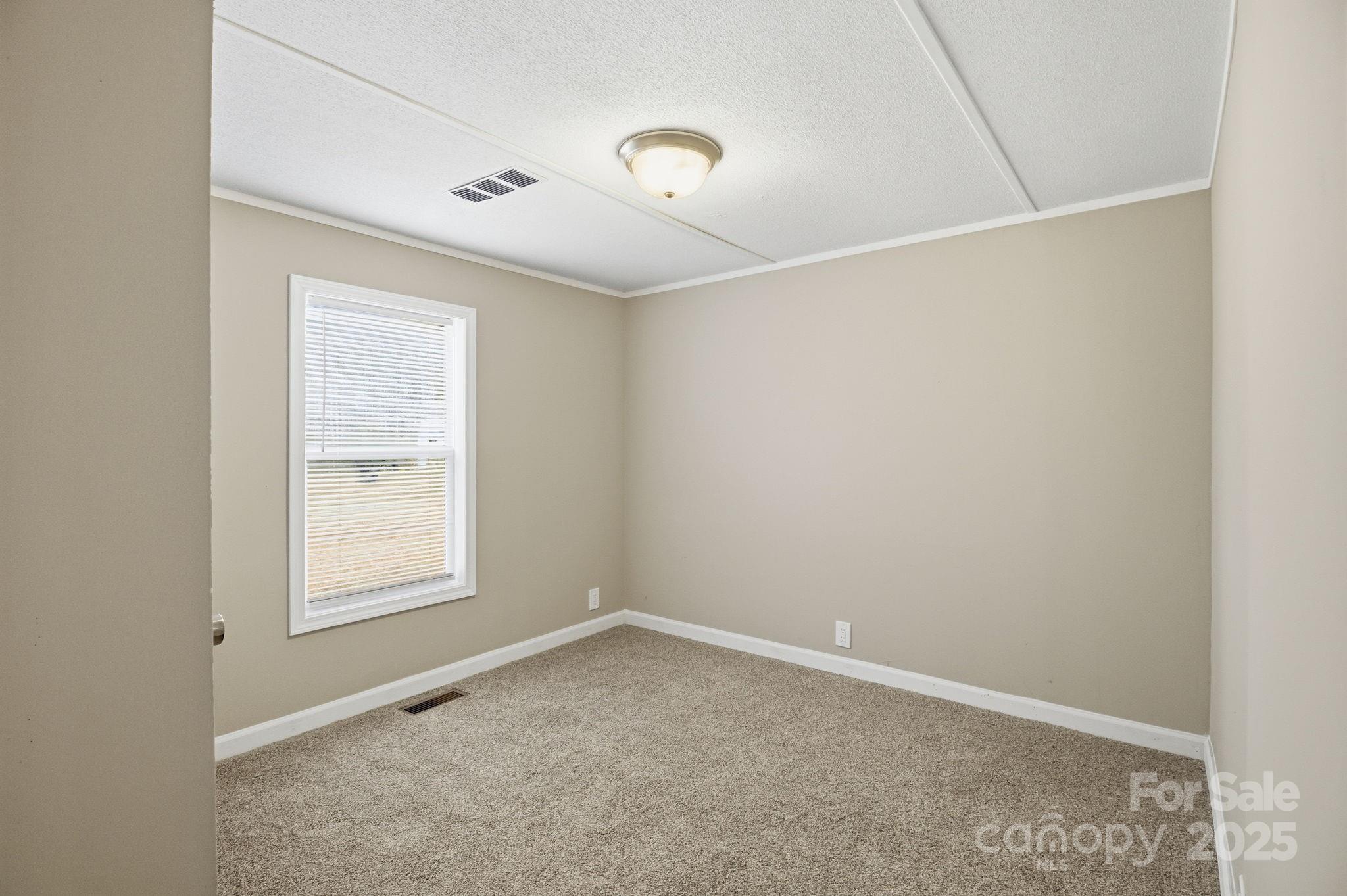 2501 Swanson Road Crouse, NC 28033 - Photo 11 of 22 an empty room with a window