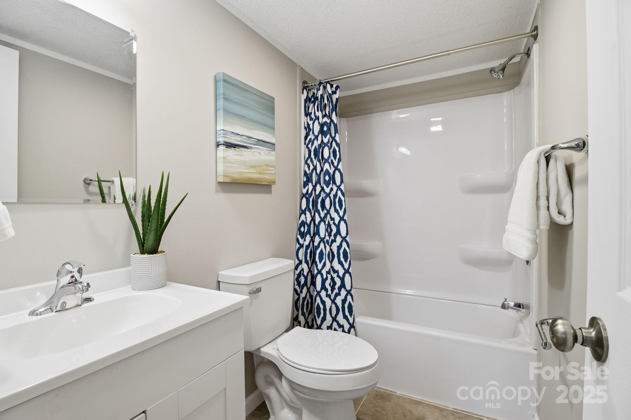 2501 Swanson Road Crouse, NC 28033 - Photo 15 of 22 a bathroom with a sink a toilet and shower