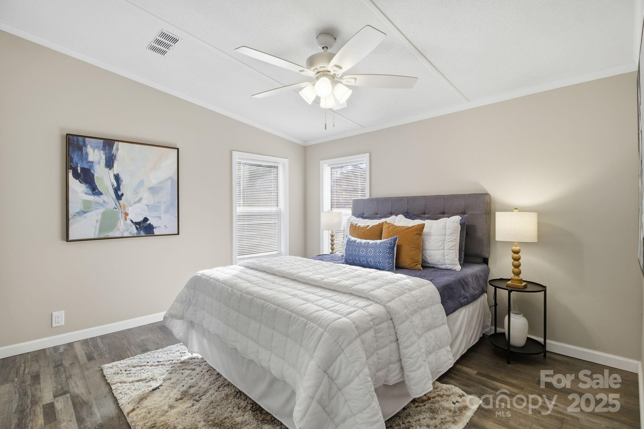 2501 Swanson Road Crouse, NC 28033 - Photo 7 of 22 a bedroom with a large bed and a chandelier