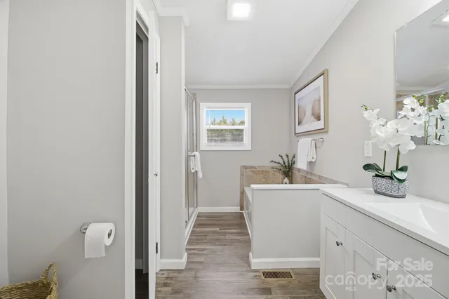 a room with a sink and a mirror