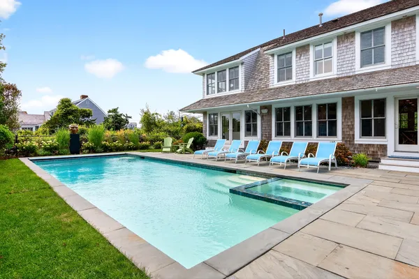a en suite bathroom with a double vanity sink mirror and shower