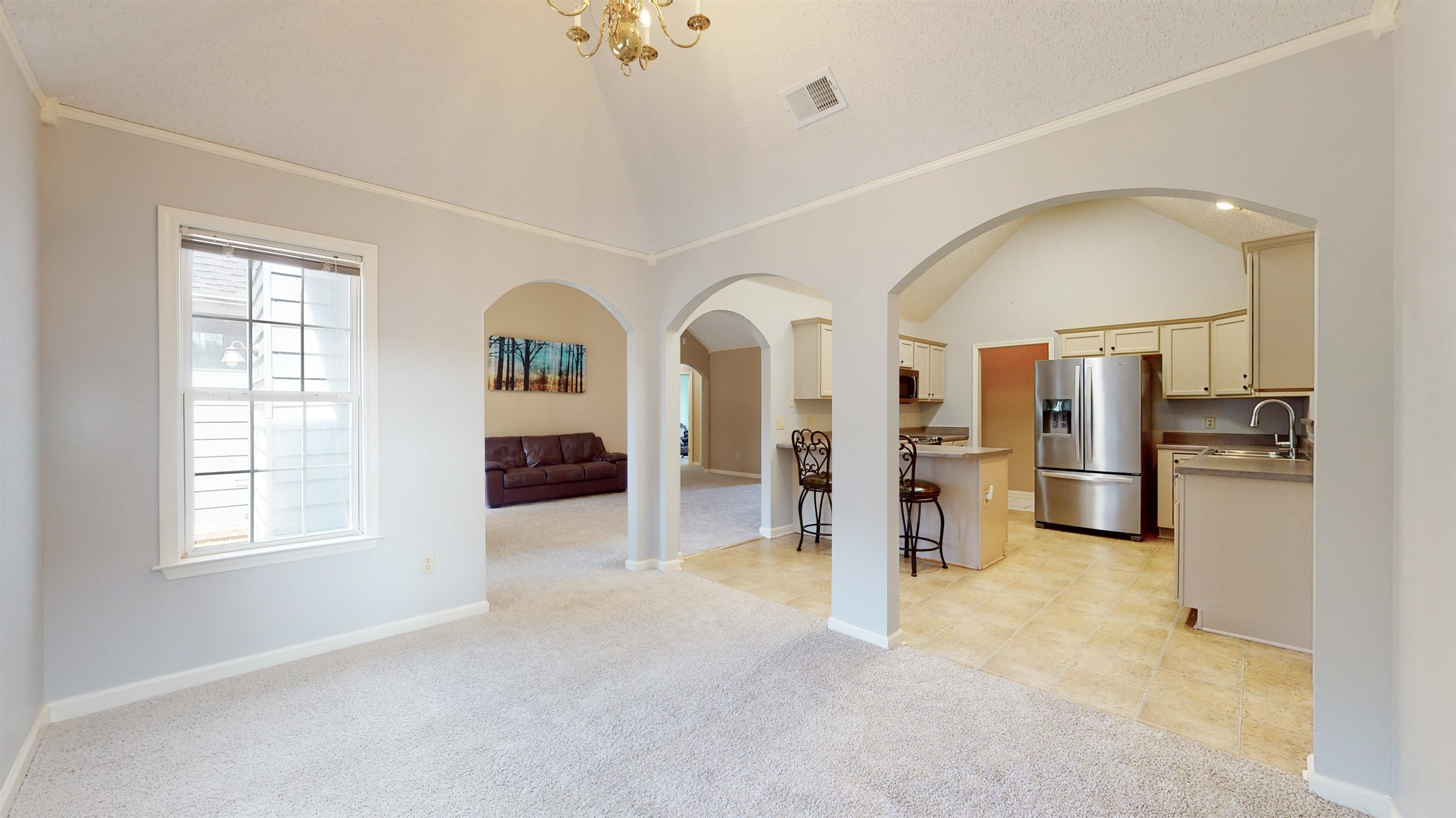 195 Cross Point Drive Collierville, TN 38017 - Photo 12 of 40 a view of a big room with windows and chandelier